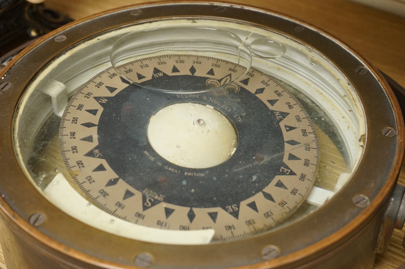 A gimballed brass cased ship's compass, by Kelvin & Hughes Ltd, 33cm diameter
